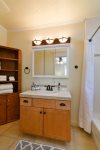 The adjoining master bath has a shower and tub